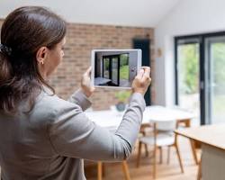Woman live streaming as she walks through a showing Property Types