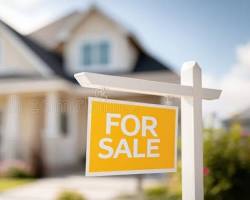 Home with for sale sign that needs to be sold so they can buy their next home Selling Home
